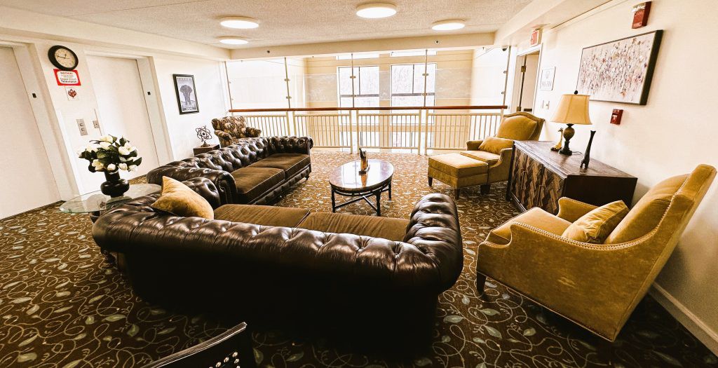 A cozy living room with plush couches and ample natural light.