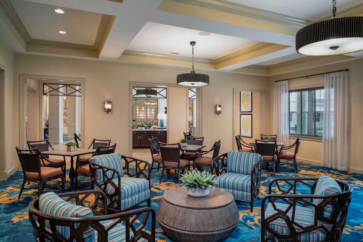 A modern lounge area with comfortable seating and stylish lighting.