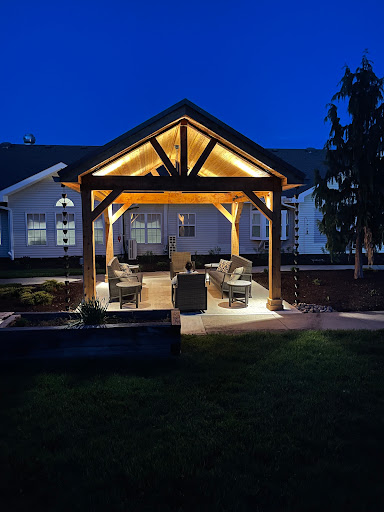 A beautifully illuminated outdoor pergola, perfect for evening gatherings.