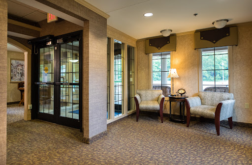 A cozy lobby area featuring comfortable seating and modern decor.