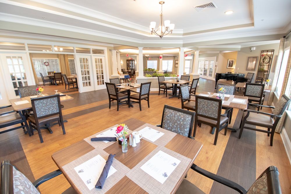 A spacious dining room with elegant decor and neatly arranged tables.