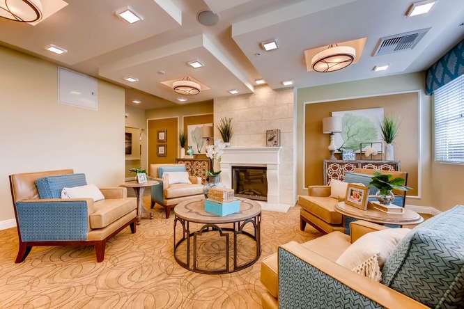 A stylish and cozy living room with comfortable seating and a modern fireplace.