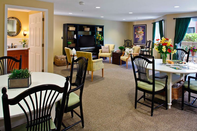 A spacious living room with comfortable seating and elegant decor.