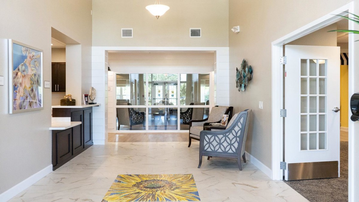 A bright and welcoming living space featuring comfortable seating and tasteful decor.