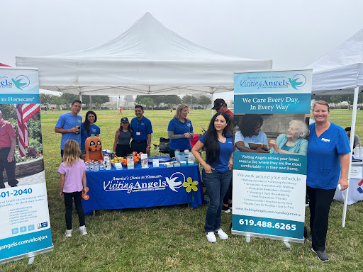 Community health event with volunteers promoting kidney health awareness.