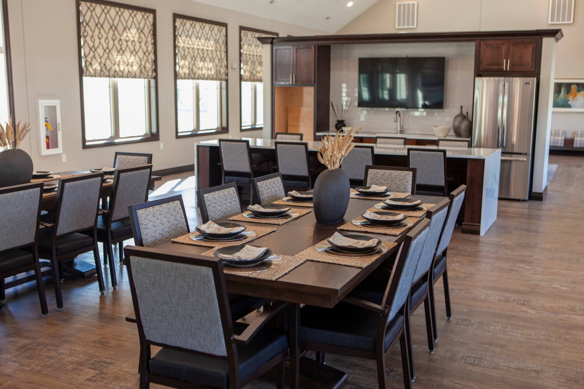 A modern dining room with an elegantly set table and contemporary decor.