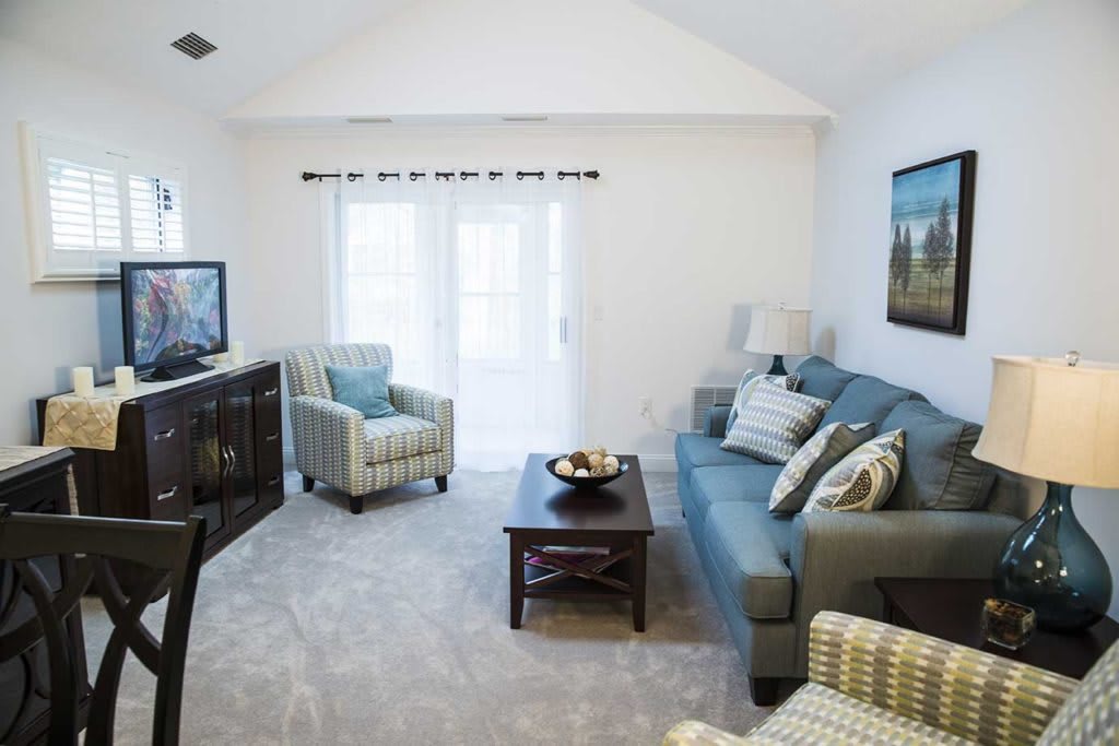 A cozy living room with comfortable seating and modern decor.
