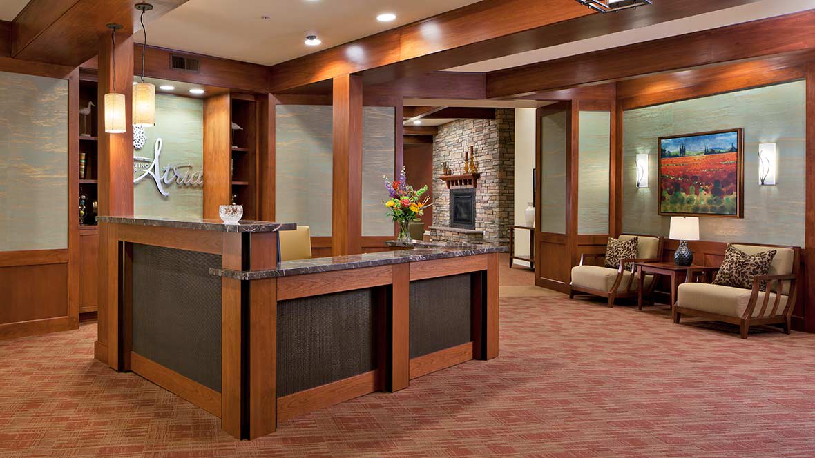 Modern office reception area with a welcoming desk and comfortable seating.