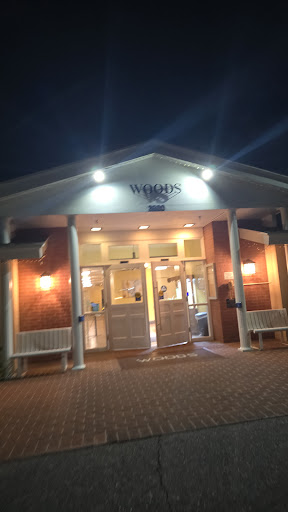 A welcoming restaurant entrance illuminated at night.