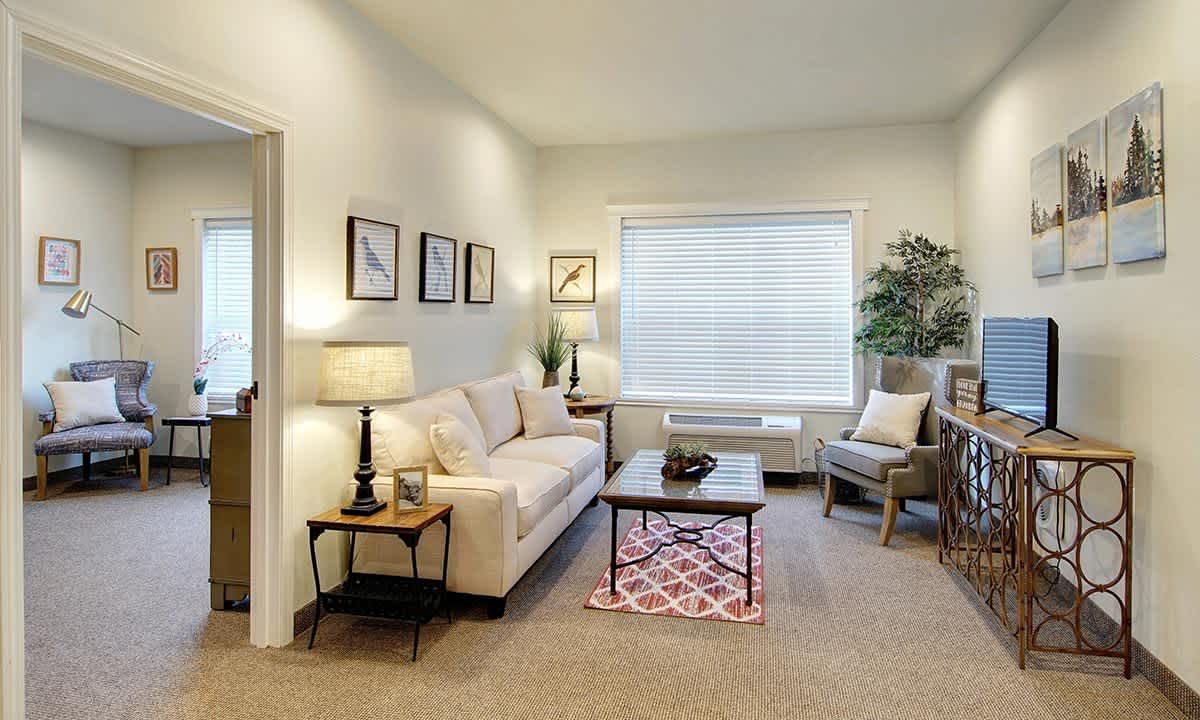 Cozy living room with comfortable seating and soft lighting.