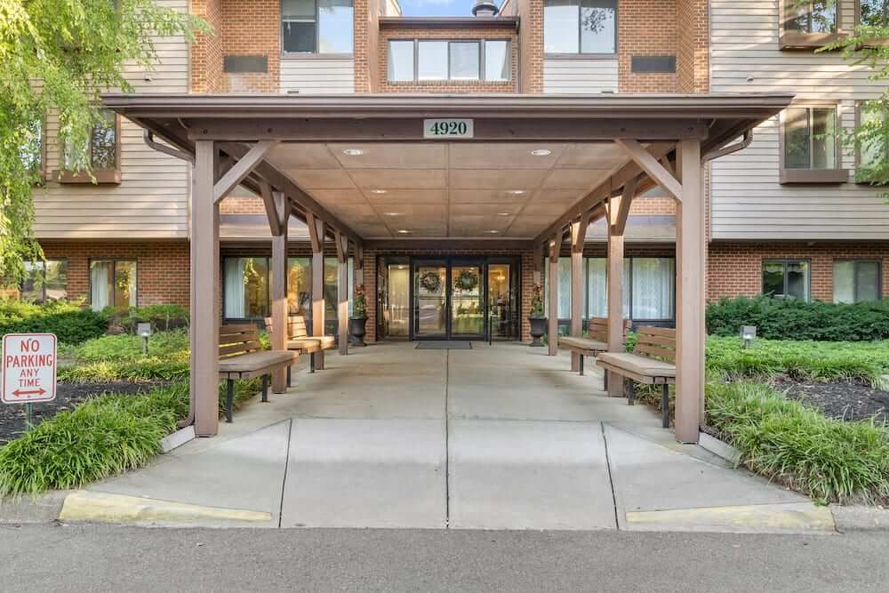 Entrance of a residential building with a covered walkway.