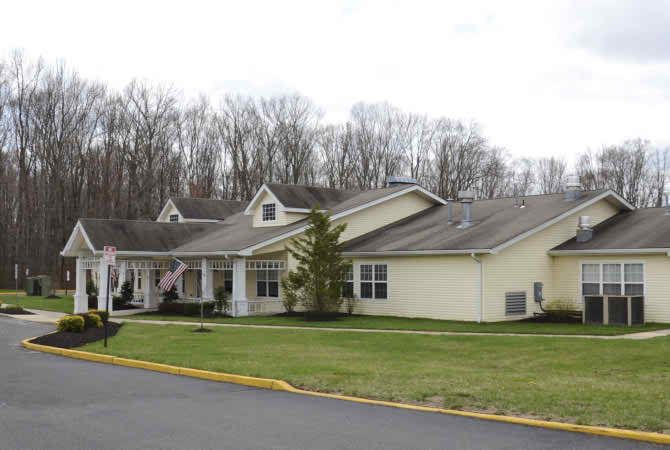 A suburban residential building with a landscaped exterior.