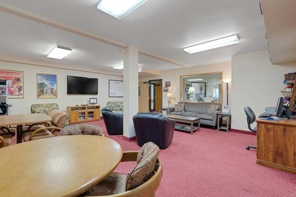 A cozy living room with comfortable seating and a television.