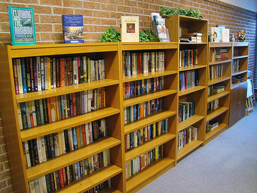 A library bookshelf filled with a collection of books.