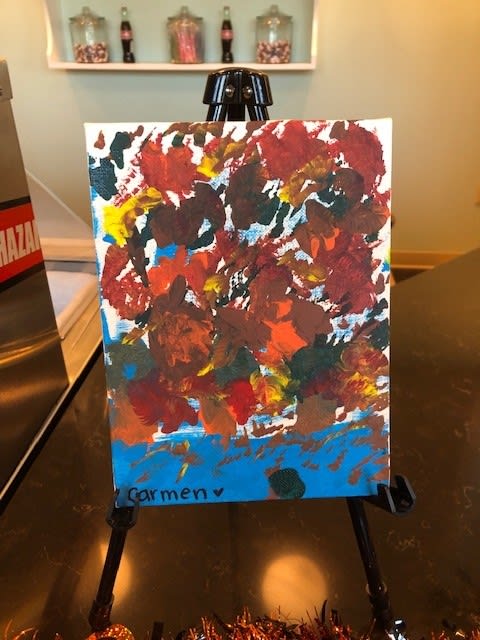 An abstract painting featuring a mix of vibrant colors on canvas.