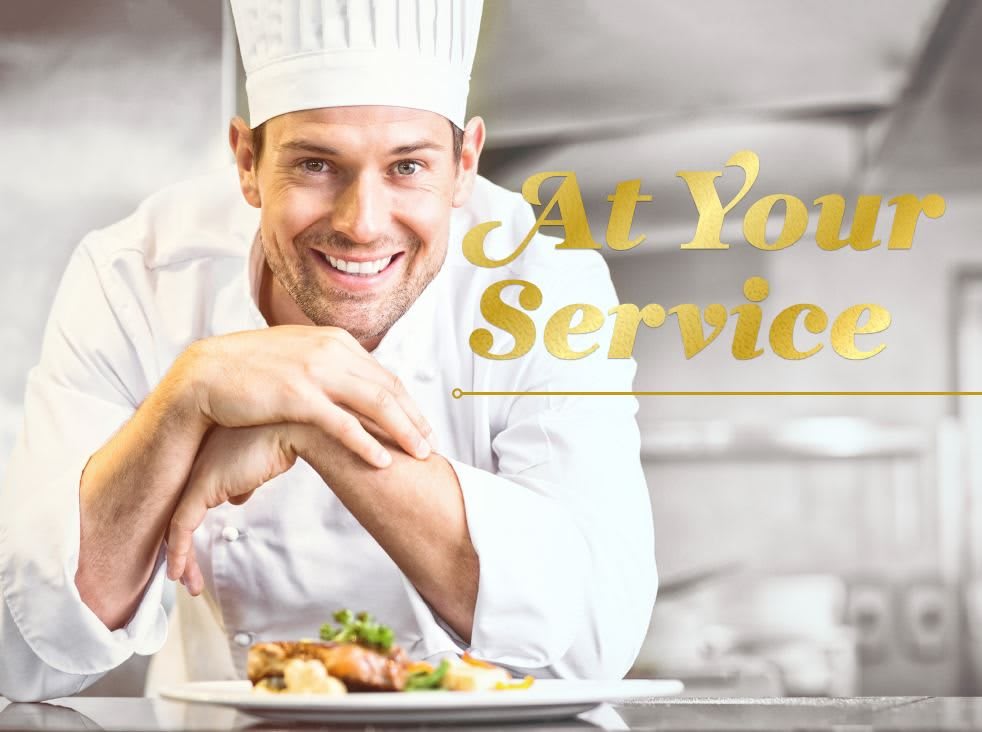 A smiling chef presenting a dish in the kitchen with the text 'At Your Service'.