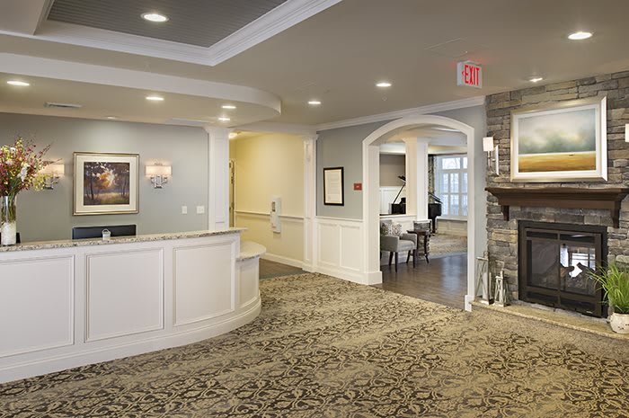 A welcoming reception area with a curved desk and elegant interior design.