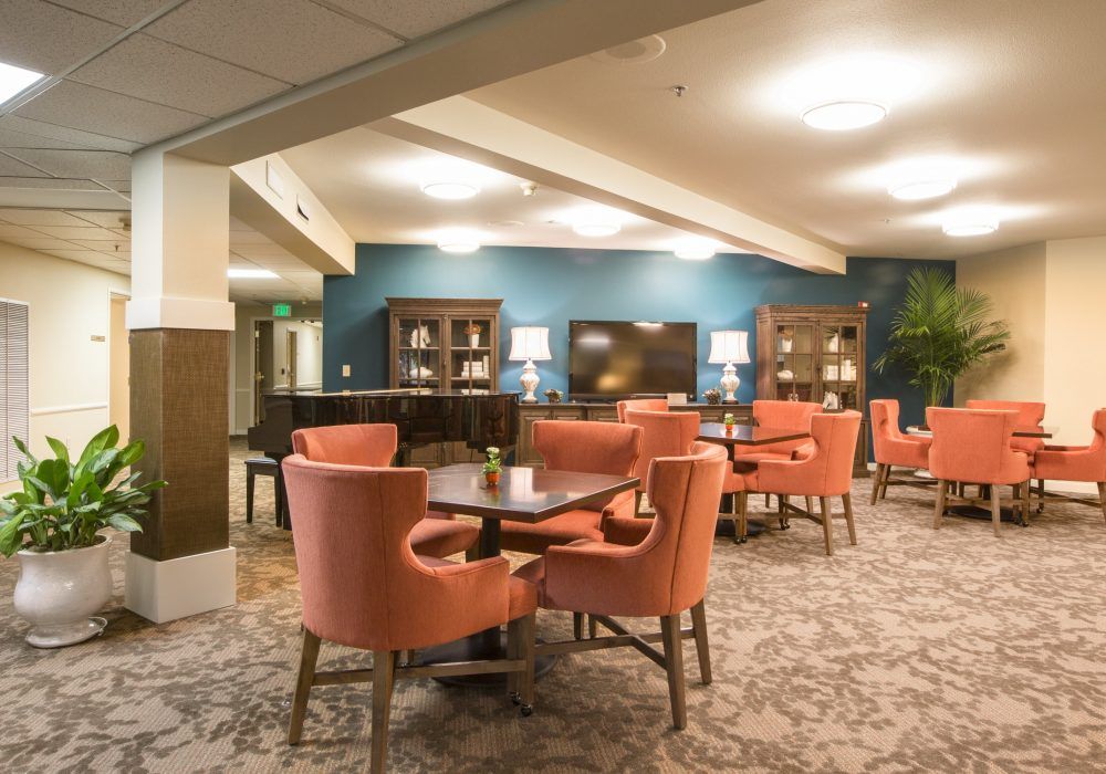 A cozy and elegant dining area with plush chairs and warm lighting.