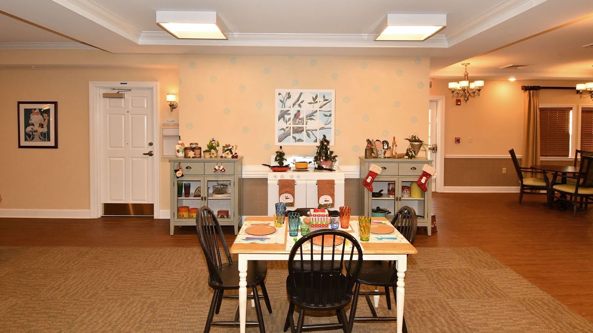A cozy dining room with a warmly decorated table and homely decor.