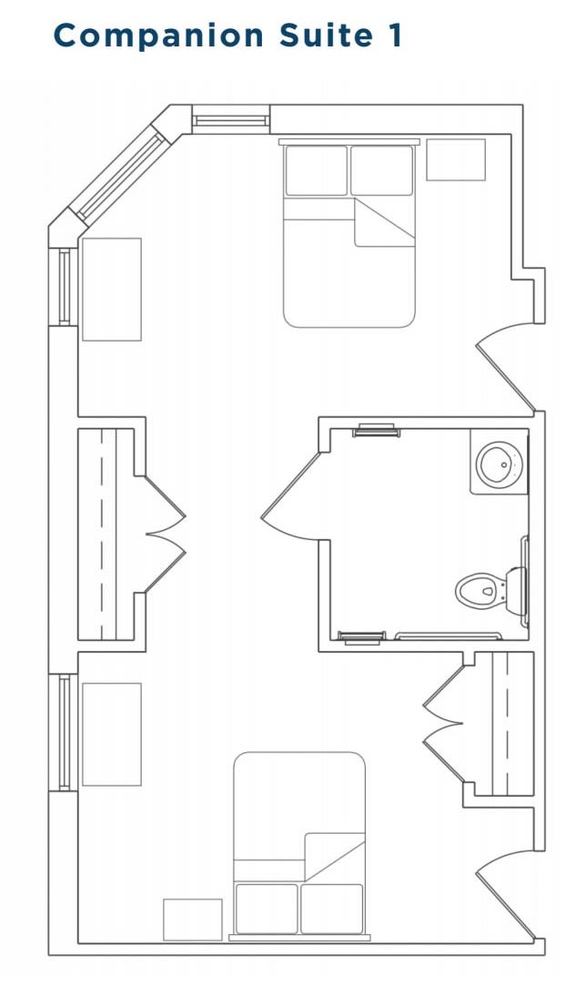 A detailed floor plan showing the layout of a room with furniture and a bathroom.