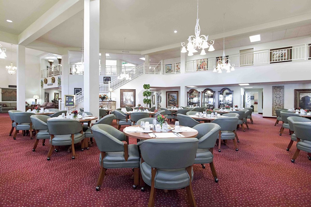 Spacious and elegantly designed restaurant interior with comfortable seating.