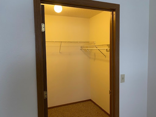 An empty closet with shelving ready for organization.