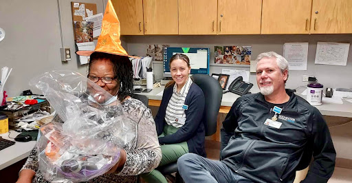 Team members enjoying a festive moment at the office.