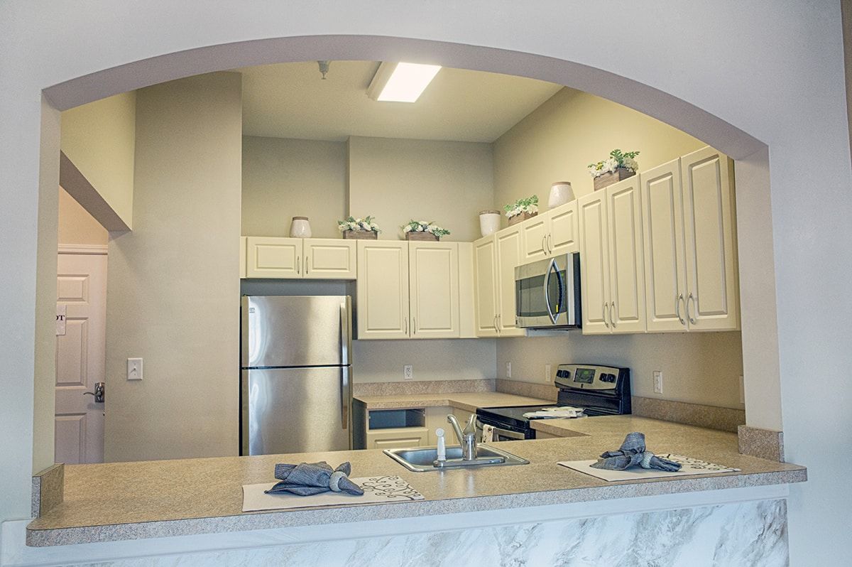 A modern kitchen with stainless steel appliances and sleek cabinetry.