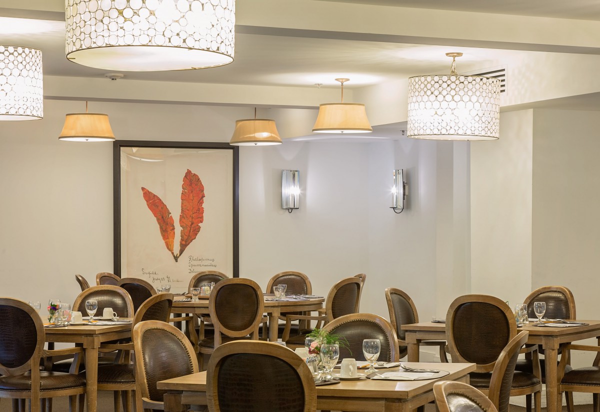 Elegant dining area with stylish decor and ambient lighting.