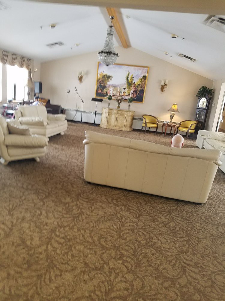 A spacious living room with comfortable sofas and elegant decor.