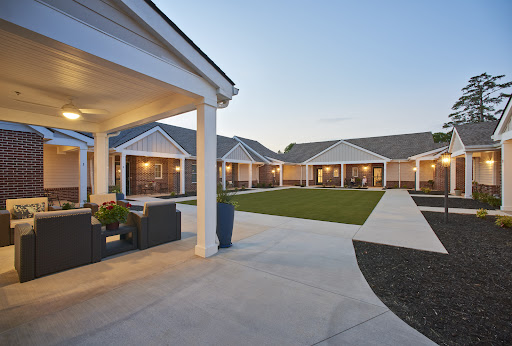 A serene courtyard view of a modern residential complex during twilight.