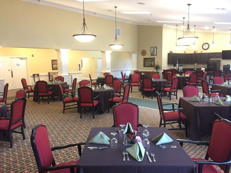 A well-decorated dining room with elegantly set tables and comfortable seating.
