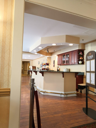 A welcoming reception area featuring a bar and wooden flooring.