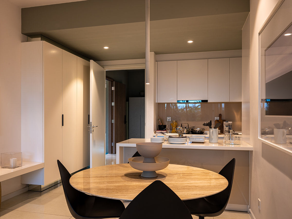 Modern kitchen and dining area with minimalist design.