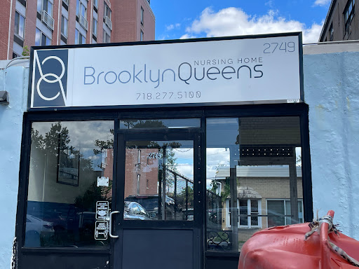 The storefront of a business named 'Brooklyn Queens', featuring modern signage and an urban backdrop.