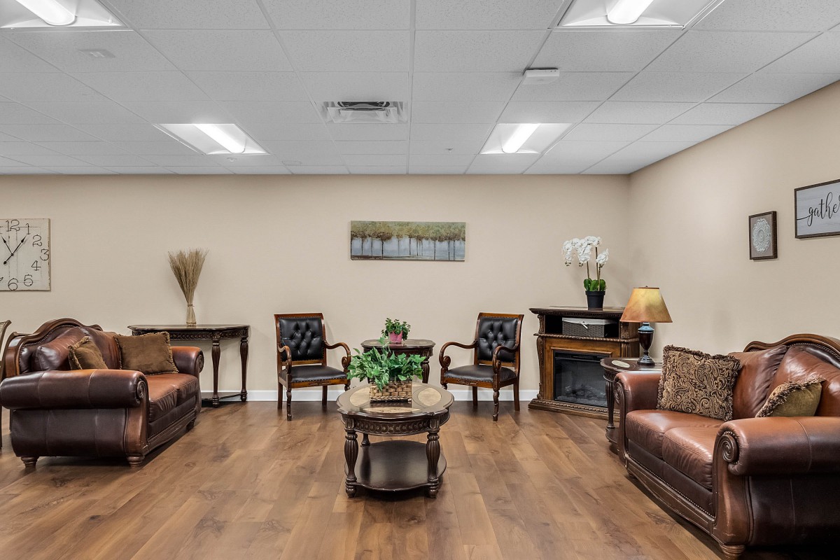 A cozy waiting room with comfortable seating and elegant decor.