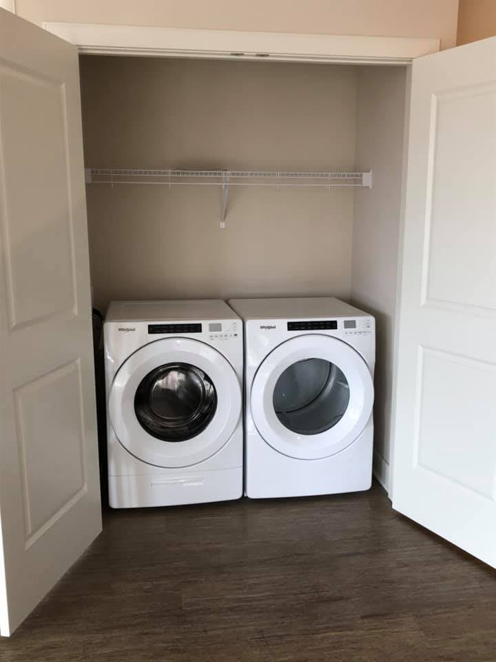 A compact laundry area featuring a washing machine and dryer.