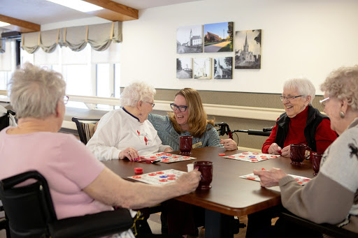 Seniors enjoying a game of bingo together in a lively community setting.