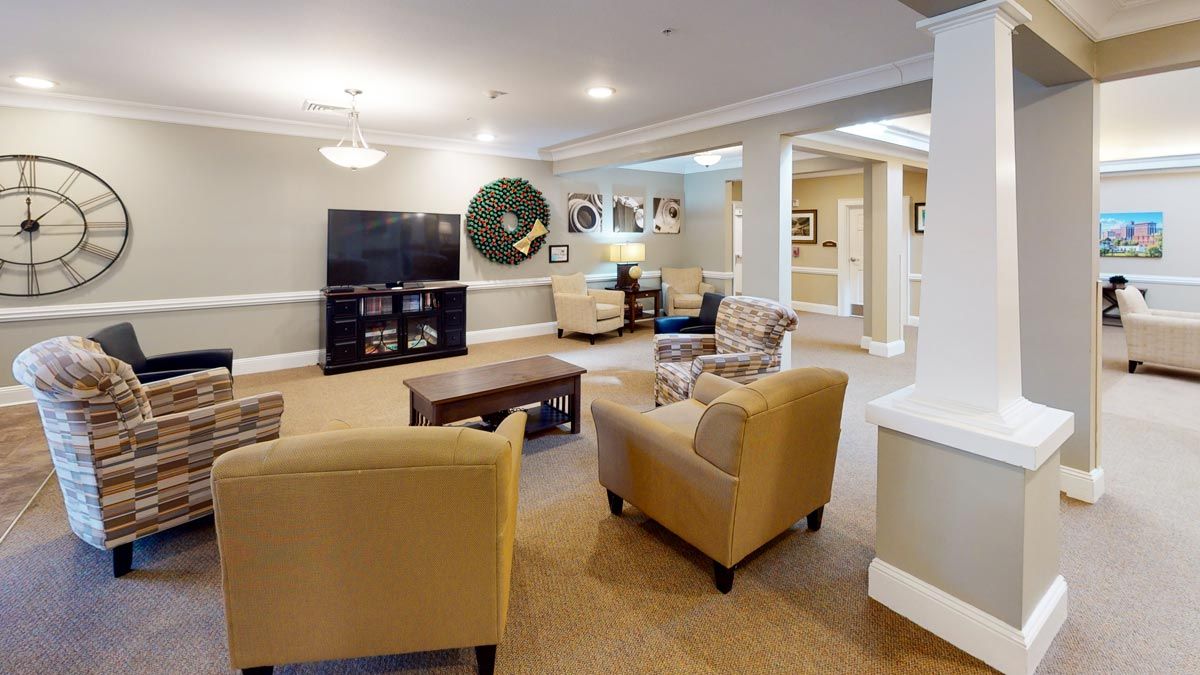 A cozy living room with comfortable seating and a TV.