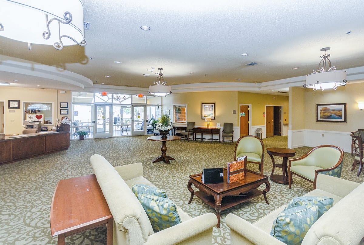 A spacious and elegantly decorated lobby with comfortable seating arrangements.
