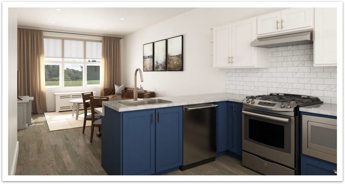 A modern kitchen with blue cabinets and stainless steel appliances in an open-plan layout.