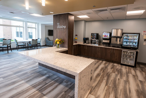 A modern reception area featuring a stylish countertop and comfortable seating.
