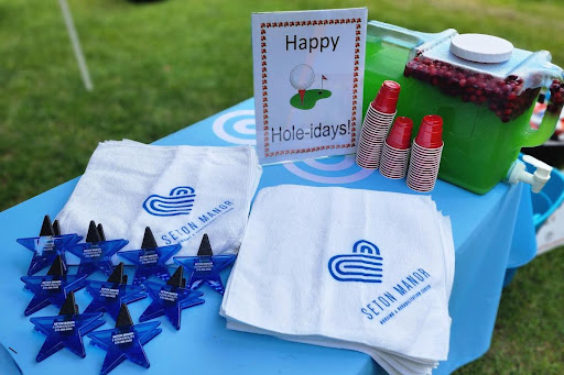 A festive setup for a birthday celebration featuring themed napkins and decorations.