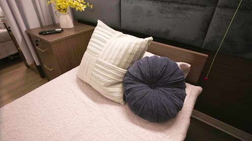 A cozy arrangement of decorative pillows on a bed.