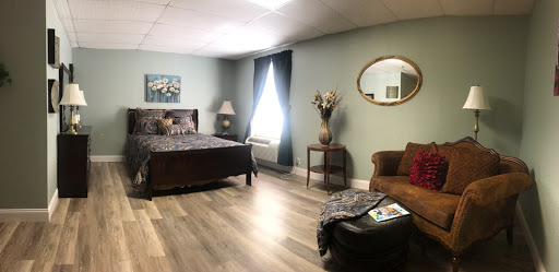 A cozy and inviting bedroom featuring modern decor and comfortable furnishings.