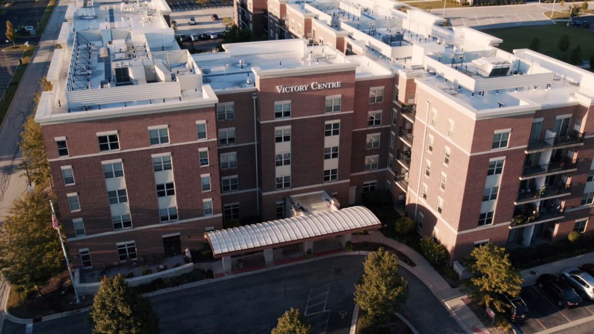 Aerial view of a hospital building with a visible entrance area.