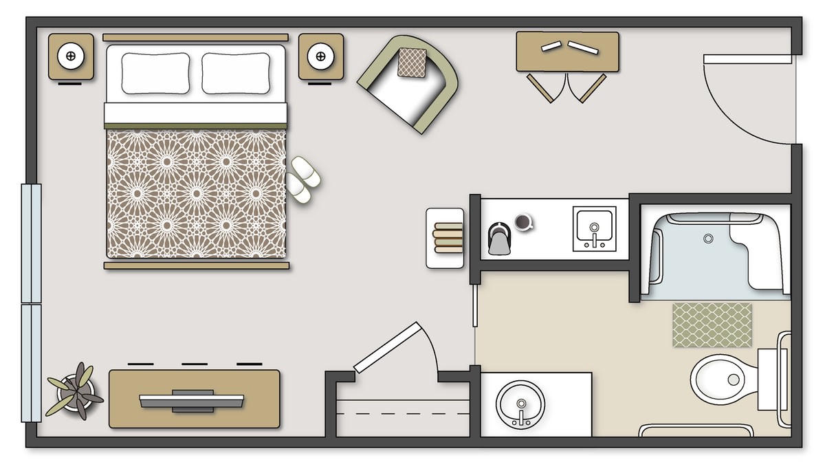 A cozy apartment floor plan featuring a bedroom, living area, kitchenette, and bathroom.