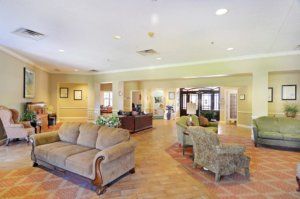 A spacious and well-lit lobby with comfortable seating arrangements.