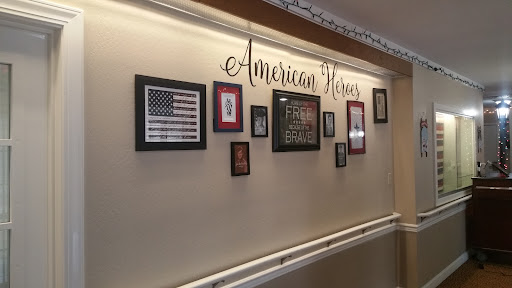 A collection of framed artworks celebrating American heritage displayed on a wall.