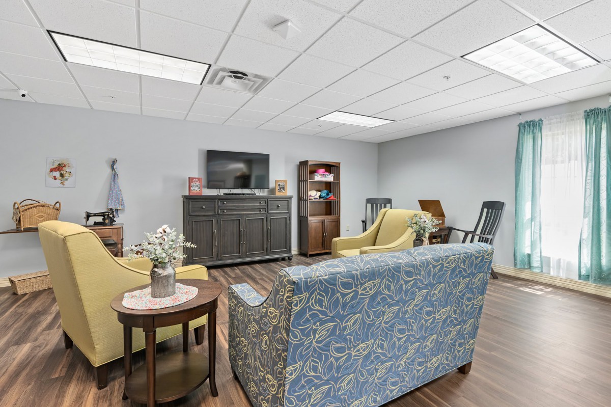 A cozy living room with comfortable seating and a TV.